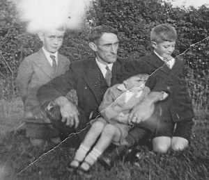 My grandad with his three sons, Tom, Frank, and my father, Joe.