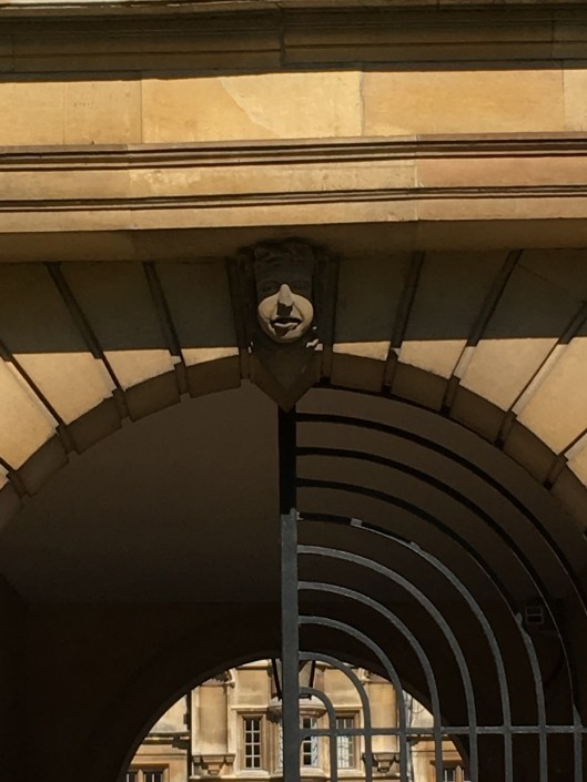 Gargoyle over a College gate.